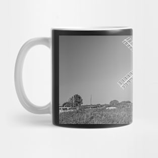 Traditional windmill on the riverbank in rural England Mug